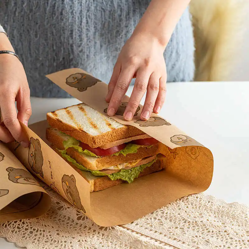 Venta caliente hamburguesa cocida grado alimenticio reciclado a prueba de grasa sándwich blanco Normal laminado embalaje de papel para envolver alimentos