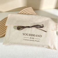 Pochette en toile personnalisée avec logo, ruban et nœud, sac anti-poussière de luxe en coton pour emballage de pyjamas (vente en gros)