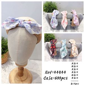 Serre-tête Nœud Papillon Femme Réglable Décontracté et Élégant avec Boucle en Herbe Synthétique - Product Image 1