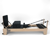 Reformer de Pilates en bois d'érable avec logo personnalisé, capacité de charge de 200 kg, lit d'entraînement pour le renforcement musculaire, équipement de yoga et de fitness pour studio