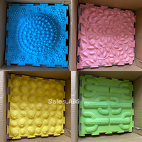 Tapis de jeu sensoriel coloré en silicone multifonctionnel à texture apaisante et tactile pour la thérapie de l'autisme
