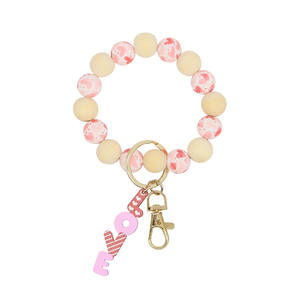 <span class=keywords><strong>Grossiste</strong></span> Bracelet de perles de <span class=keywords><strong>silicone</strong></span> à la mode Porte-clés Saint Valentin en bois personnalisé Porte-clés en bois avec impression UV pour porte-clés en métal - Product Image 1