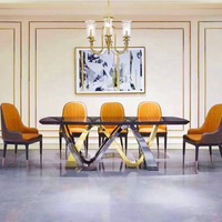 Ensemble de table à manger de conception royale du marché du mobilier de Foshan, moderne, 8 chaises, base en métal doré rose