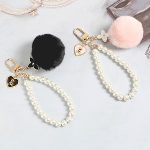 Nuevo y Elegante Llavero con Bola de Pelo Suave y Esponjosa, Colgante de Corazón y Trébol, para Bolsos y Llaves de Coche, Regalos de Cumpleaños - Product Image 1