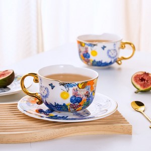 ชุดถ้วยชาและจานรองเซรามิคทรงกลมแบบไม่สมมาตร ถ้วยกาแฟตกแต่งสำหรับงานเลี้ยงและเป็นของขวัญ - Product Image 1