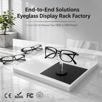 Présentoir à lunettes en acrylique noir et blanc contrastant, support haut pour lunettes, étagère arrière transparente à double couche, présentoir de comptoir