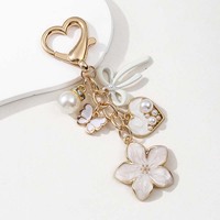Porte-clés en métal pour femme, motif fleurs colorées et nœuds, avec perles et papillons, tendance et personnalisé, vente en gros