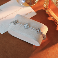 Bracelet trèfle porte-bonheur plaqué argent, tendance transfrontalière, avec chaîne ajustable, zircon brillant et coquille blanche