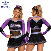 Uniforme de cheerleading personnalisé violet et noir avec épaules découpées en maille, jupe ornée de strass et haut à manches longues pour compétition All Star