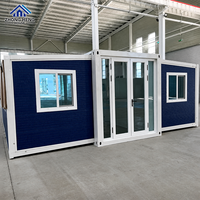 Casa Container Espandibile Gialla Personalizzabile con Telaio Bianco a T, Doppia Porta in Vetro, Completamente Arredata, con Cucina e Magazzino