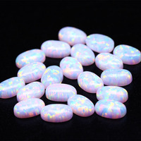 Cabochons d'opale blanche de qualité OP17 Opale de feu synthétique à fond plat en forme d'oeuf Gemmes en vrac pour bagues Forme de pierre précieuse ovale