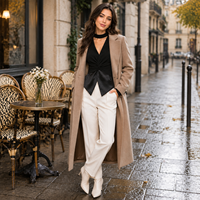 Haut en tricot élégant pour femme, col montant, manches bouffantes, peplum fendu, torsadé sur le devant, en mélange de laine personnalisé