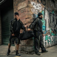 Conjunto Deportivo Personalizado con Ribete Reflectante, Chaqueta Cortavientos Ligera y Pantalones de Chándal con Diseño de Parches Sostenibles para Hombre