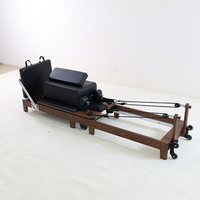 Machine de Pilates pliable en bois de noyer avec plateforme de saut et boîte pour salle de sport à domicile