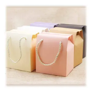 Wholesale color christening candy storage gift wrapper paper boxes with handle rope for wedding favors packaging chocolate sweet