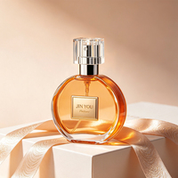 Flacon de parfum rond en verre de luxe personnalisé de 30 ml, 70 ml, 100 ml avec pompe pulvérisatrice, impression sérigraphique, emballage écologique et étanche