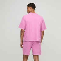 Ensemble de sport 2 pièces pour homme en coton respirant rose uni avec surpiqûres contrastées, coupe ample, short et t-shirt, vente en gros