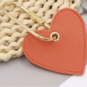 HR Wholesale PU Leather Embossed Heart Leather Keychain Modern <b>Key</b> <b>Rings</b> Personalised Saffiano Leather Heart Keyring for Gifts - Product Image 4