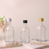 Bouteilles en verre transparentes rondes de 50 ml rechargeables pour vin, boissons, thé au lait, jus, avec bouchons à vis en métal