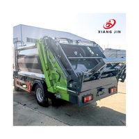 Camion benne à ordures électrique 4x2 neuf avec système de chargement manuel Roll-On/Roll-Off, bras à crochet, boîte de vitesses recyclable, chargeur arrière et moteur de pompe