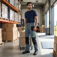 Pantalon de travail durable à blocs de couleur avec genouillères renforcées, poches cargo zippées et rangement, idéal pour les équipes d'ingénierie