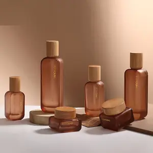 2023 desain baru tutup bambu/50ml/100ml/120ml botol kaca datar perawatan kulit kemasan tutup kayu pompa lotion/semprot/botol minyak serum