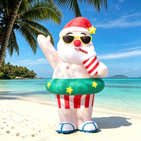 Père Noël gonflable d'été avec bouée et lunettes de soleil, décoration de Père Noël imperméable, buvant du jus et se relaxant sur la plage