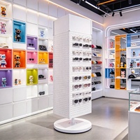 Présentoir rotatif en métal perforé sur mesure pour magasin de détail, idéal pour accessoires de téléphonie, jouets, autocollants, cartes postales, snacks et aliments.