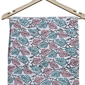 This beautiful hand block print white cotton fabric features a charming vine branch pattern with delicate pink and mint <b>green</b> - Product Image 1