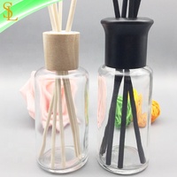 Bouteilles en verre de diffuseur rondes de 100ml à vendre Bouteille vide de diffuseur de roseau d'arôme avec le chapeau et le bouchon