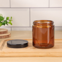 Stoples Kaca Bulat Transparan Amber 180ml untuk Makanan, dengan Tutup Plastik Hitam untuk Kemasan Madu, Selai, dan Saus