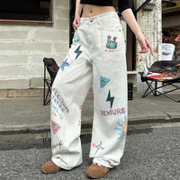 Jean en denim blanc déchiré pour homme, style américain, avec graffiti peint à la main et imprimé dessin animé, coupe ample et jambe large