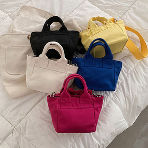 กระเป๋าผ้าแคนวาสสไตล์เกาหลีเรียบง่ายสำหรับผู้หญิง แบบเปิดปิด สีพื้น ใช้ซ้ำได้ สะพายไหล่เดียว ใช้ได้ทุกวัน ราคาถูก ขายส่งทุกแบบ - Product Image 1