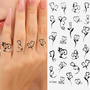 Autocollants de <span class=keywords><strong>tatouage</strong></span> temporaires de luxe pour le corps, les <span class=keywords><strong>bras</strong></span>, le maquillage, imperméables, à motif de petite fleur noire en forme d'étoile de dessin animé, vente en gros OEM - Product Image 2