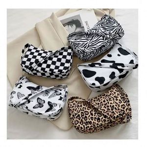 Wholesale Butterfly <b>Candy</b> Pattern Button Closure Single Strap PU Handbags Fashion Women Shoulder Bags 6 Inch Polyester Lining - Product Image 1