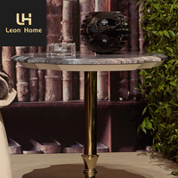 Table basse centrale de luxe moderne avec dessus en marbre noir Base en acier inoxydable doré et pierre naturelle pour meubles de maison
