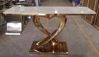Table d'entrée de luxe avec design en forme de cœur, base en métal doré brillant, table décorative pour couloir, plateau en pierre frittée, console