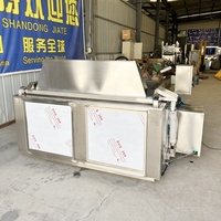 Cuiseur à vapeur en nid d'abeille entièrement automatique avec décharge par bascule du panier pour la production en série en usine alimentaire