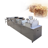 Petite échelle bonbons noix de céréales riz barre granola pressant faisant la ligne de production écrou barre de sésame machine de fabrication de coupe