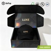 Boîte d'expédition rigide élégante en carton ondulé noir mat certifié avec estampage holographique et fermeture à oreilles, pour chapeaux