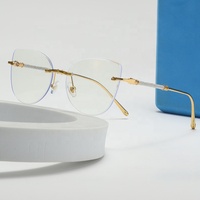 Lunettes optiques photochromiques de luxe sans monture, forme papillon, pour femmes, anti-lumière bleue, anti-reflets, monture en métal, style œil de chat