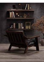 Fauteuil lounge en cuir noir de style mid-century avec structure en bois de noyer, fauteuil d'appoint monoplace, mobilier de salon pour la maison ou le bureau