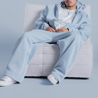 Ensemble jogging homme personnalisé 2 pièces : sweat à capuche zippé oversize et pantalon de survêtement large bleu clair uni, style streetwear décontracté