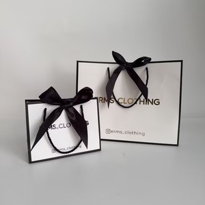 Custom Logo High Hardness Matte White Gift Shopping Handbag Multi Sizes Fashion Brand Gift <b>Paper</b> Bags with Black Twisted Handle - Product Image 1