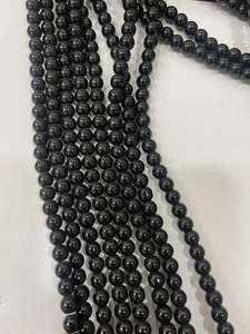 Perles rondes lisses en hématite naturelle de haute qualité avec cordon extensible blanc - Product Image 6