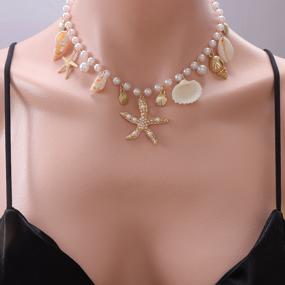 Pearl starfish and conch necklace