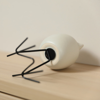 Figurine d'oiseau en céramique nordique avec pieds en fil métallique noir, sculpture minimaliste pour table, armoire, hôtel, café, cadeau de pendaison de crémaillère