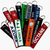 En gros, Jet Tag en tissu avec logo tissé 'Remove Before Flight', porte-clés brodé, anneau porte-clés en tissu avec logo personnalisé, cadeau promotionnel