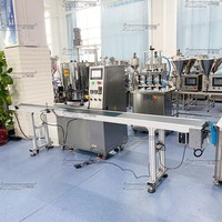Machine de remplissage d'huile pneumatique automatique à tête unique pour les applications de boissons en verre et en plastique avec moteur mélangeur, capacité de 200 ml