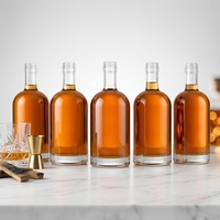 Bouteilles en verre rondes de style nordique en gros avec bouchon en liège et marquage à chaud pour spiritueux, vins et boissons
